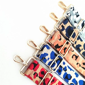 Detail of adjustable leopard print bag straps with gold metal hooks in five vibrant colors