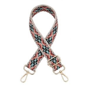Close-up of bohemian geometric woven purse strap with premium gold metal hardware