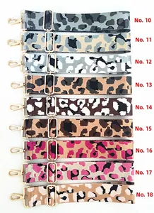 Nine adjustable leopard print bag straps with golden buckles in various colors