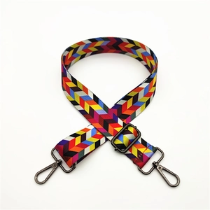 Close-up of adjustable woven chevron strap with metallic gunmetal swivel hooks