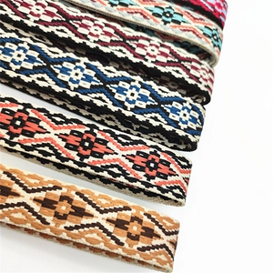 Detailed view of adjustable ethnic woven bag straps with colorful geometric patterns