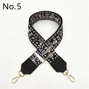 Detail of Style 5 ethnic embroidered bag strap with floral patterns and gold metal hooks