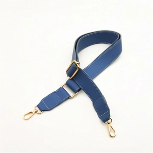 Blue PU leather bag strap with gold metal buckles and white contrast stitching details