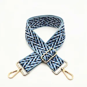 Adjustable woven chevron shoulder strap for handbags with golden metal lobster clasps