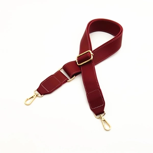 Adjustable dark red replacement shoulder strap with white contrast stitching and gold buckles