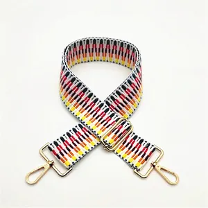 Ethnic woven wide shoulder strap with red yellow geometric patterns and gold metal buckles