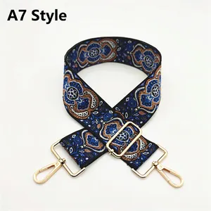 Ethnic style jacquard bag strap with blue geometric pattern and gold metal buckles