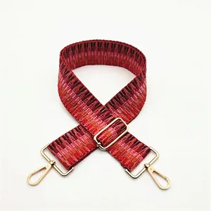Close-up of No. 24 ethnic jacquard bag strap with geometric patterns and gold metal hooks