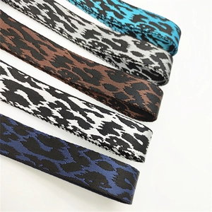Detail of multi-color leopard print webbing straps in blue, brown, and grey textures