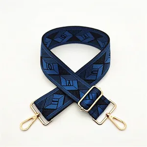 Detail of adjustable blue and black geometric diamond pattern wide shoulder strap