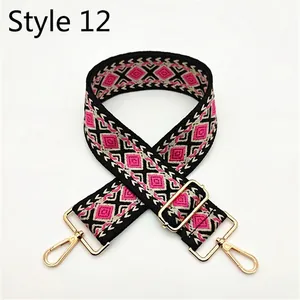 Detail of diamond pattern woven shoulder strap with golden metal swivel hooks and buckles