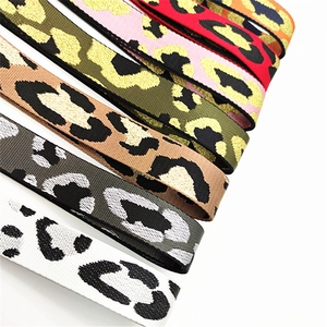 Detailed view of woven leopard print bag straps in multiple stylish color combinations
