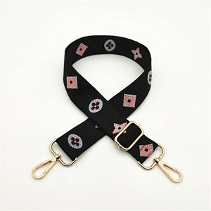 Adjustable black crossbody bag strap with pink and blue floral embroidery and gold clips