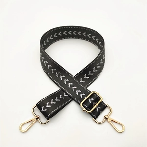 Adjustable black strap with white V-pattern and golden lobster clasps for bags