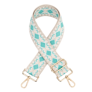 Adjustable geometric woven bag strap with blue diamond pattern and gold hardware hooks