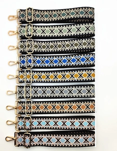 Detail view of colorful geometric diamond pattern bag straps with gold metal hooks