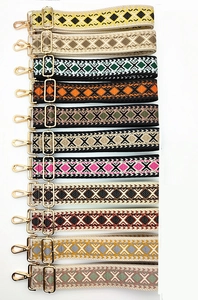 Adjustable woven shoulder straps with geometric patterns and gold metal hardware for bags