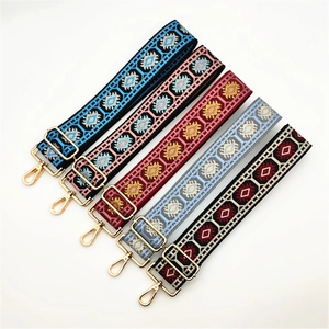 Detailed view of five colorful ethnic style woven bag straps with gold metal clasps