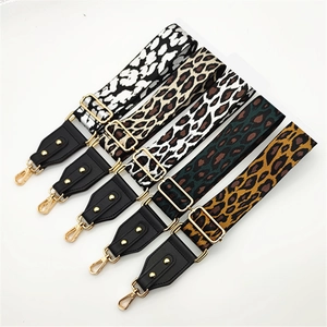 Detail of adjustable leopard print bag straps with gold metal hooks in five vibrant colors
