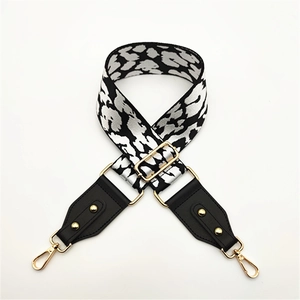 Adjustable wide leopard print bag strap with black leather ends and gold metal clips