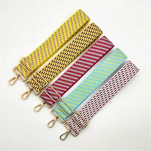 Adjustable wide replacement straps with geometric patterns and gold hardware for handbags
