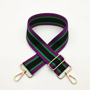 Adjustable striped shoulder strap with purple and green patterns and gold metal buckles