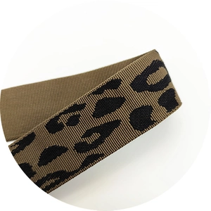 Close-up of thick leopard print woven bag strap showing dense nylon texture and pattern