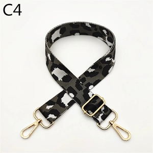 Close-up of leopard print replacement strap with golden lobster clasps and metal slider