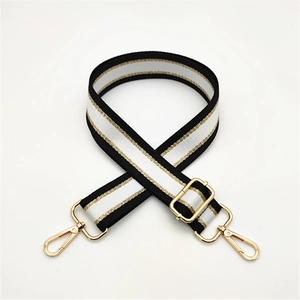 Adjustable black and white striped bag strap with gold metal buckles for shoulder bags
