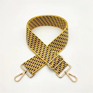Adjustable woven shoulder strap with yellow geometric pattern and gold swivel hooks
