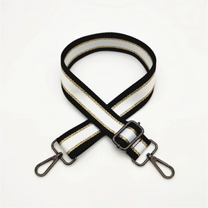Adjustable black and white striped shoulder strap with gold thread and gunmetal hardware