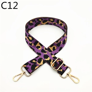 Detail of adjustable purple leopard print strap with gold metal lobster clasps and buckle