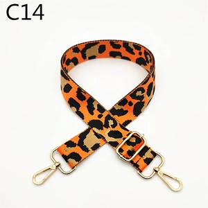 Detail of adjustable leopard print bag strap with polished gold-tone metal lobster clasps