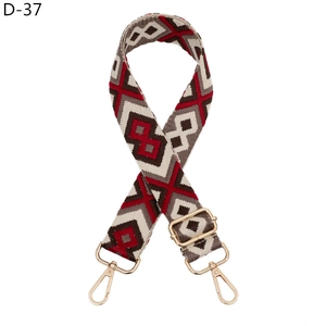Detail of diamond weave purse strap with gold metal swivel hooks and adjustable buckle