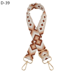 Macro shot of adjustable diamond pattern woven strap with golden metal lobster clasps