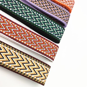 Detail of thickened adjustable bag straps featuring colorful wave jacquard patterns