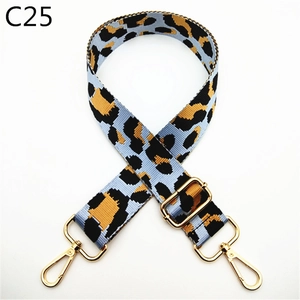 Detail of adjustable leopard print bag strap with golden metal swivel lobster clasps