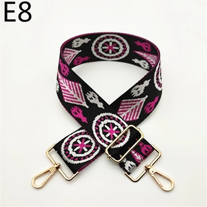 Close-up of ethnic geometric pattern woven strap with gold metal lobster clasps