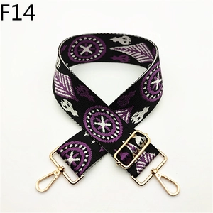 Detail showing adjustable Bohemian jacquard shoulder strap with golden metal hardware