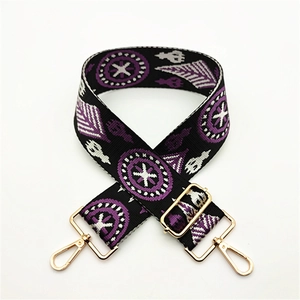 Adjustable woven shoulder strap for bags with purple geometric pattern and gold clips