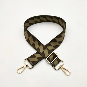 Detail of adjustable geometric strap with high-quality gold metal swivel lobster hooks