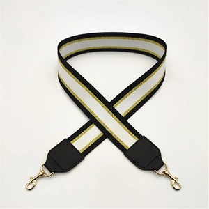 Fashionable wide bag strap with black white gold stripes and gold lobster clasp accessories