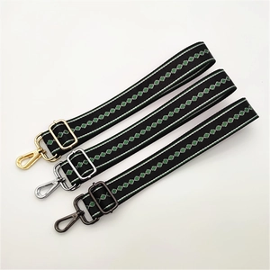 Adjustable woven replacement bag strap with green diamond pattern and metallic hooks