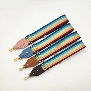 Adjustable wide rainbow striped shoulder straps with PU leather ends and gold hardware