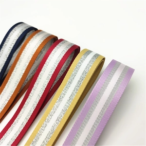 Close-up of colorful striped shoulder straps with shimmering silver metallic thread details