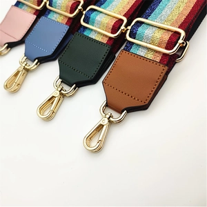Detail of wide replacement bag straps with rainbow glitter and gold-tone metal hooks