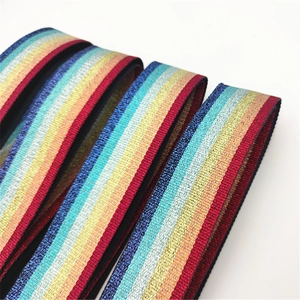 Close-up of wide colorful rainbow handbag strap with metallic glitter thread detail