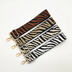Adjustable wide replacement bag straps with animal print patterns and gold hardware