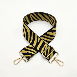 Adjustable zebra print bag strap with golden metal hooks for crossbody bags