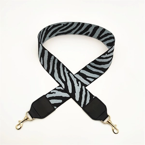 Adjustable zebra print wide shoulder strap with black leather ends and gold metal clasps